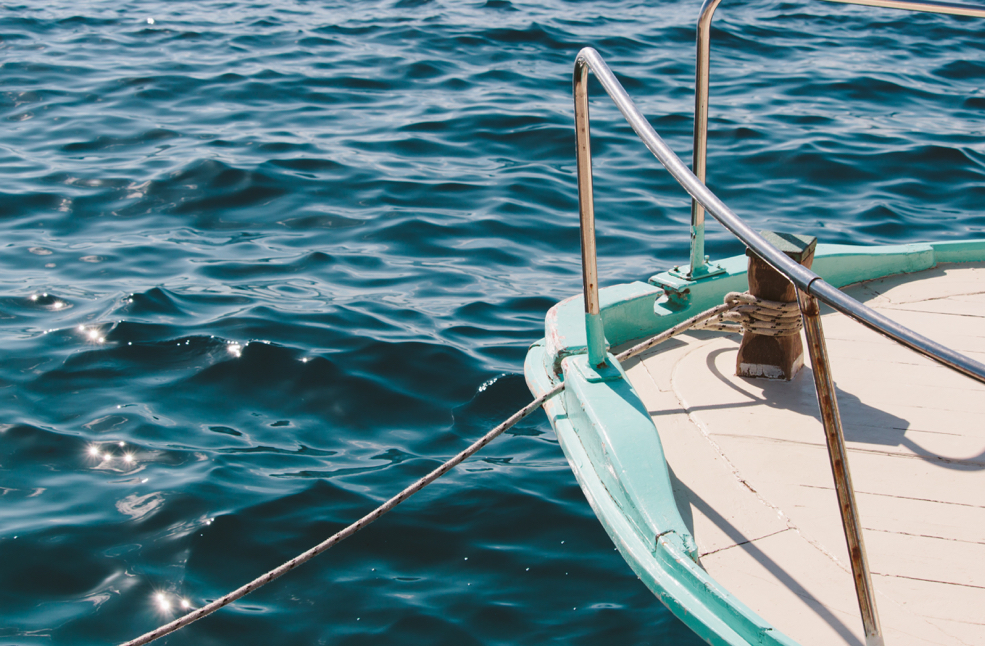 A close-up of the prow of a tied-up boat.